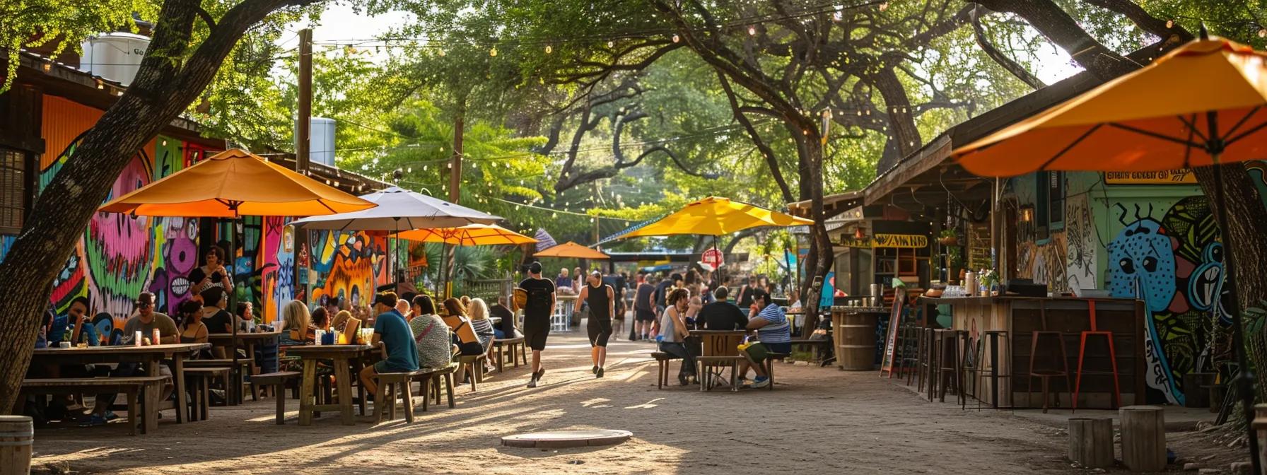 a vibrant scene in east austin captures lively locals enjoying a sun-drenched day surrounded by colorful murals and lush greenery.